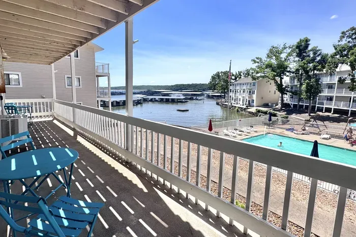 Patio area over looking community pool and lake