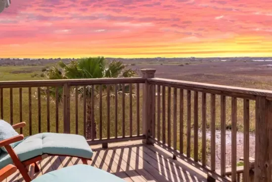 Stunning sunset views over the private backyard and marsh.