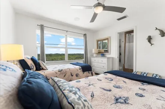 twin bedroom upstairs with ocean views