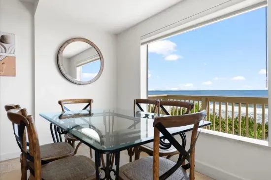 informal dining in the kitchen with ocean views - seats 6