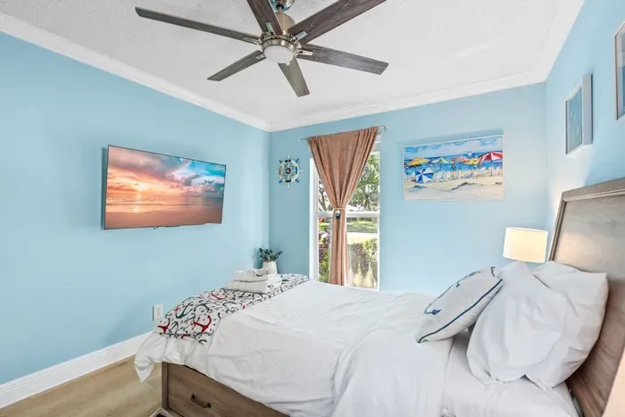 This bedroom also features a 55" HDTV.