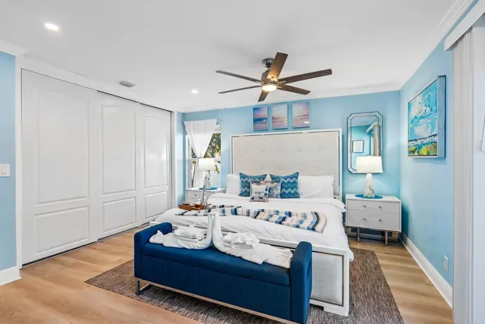 This primary bedroom has french doors leading out to the pool deck.  Head back and relax quietly without having to make your way from the living room.
