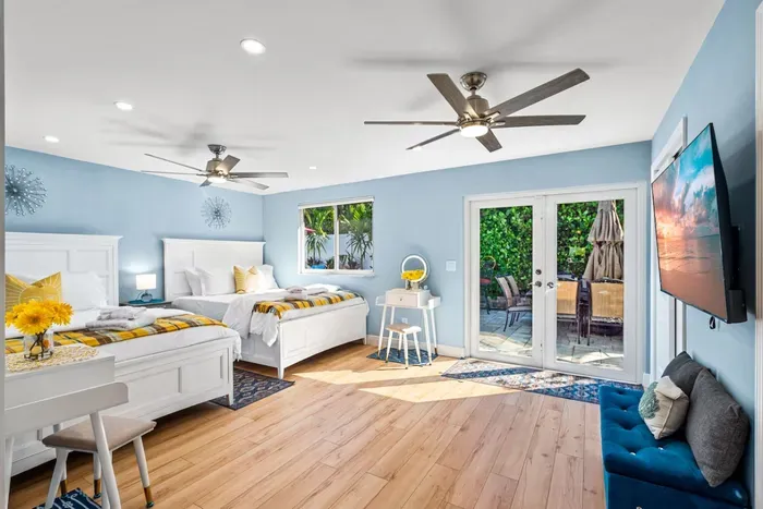 Moving on into bedroom 3 which is situated next to the pool table & dining rooms. This room has direct access straight out to the backyard area and features 2 make-up vanities.