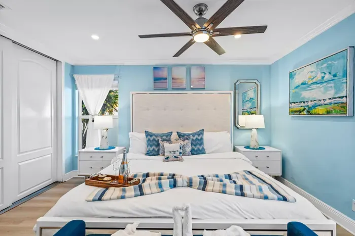 This primary bedroom has french doors leading out to the pool deck.  Head back and relax quietly without having to make your way from the living room.