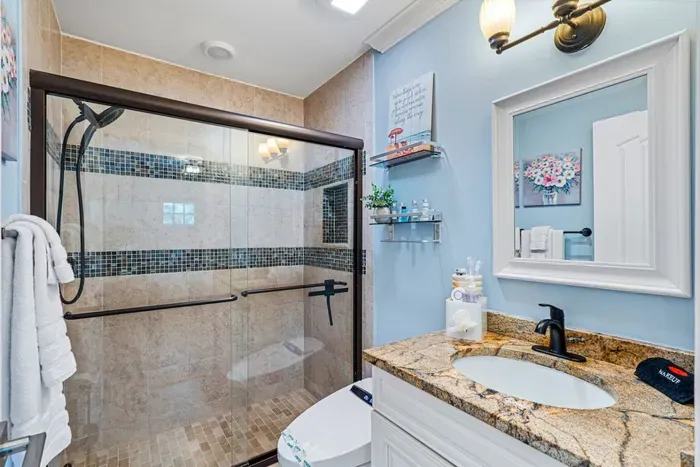 Welcome into the 2nd bathroom with yet another beautiful shower and features a smart toilet bidet.