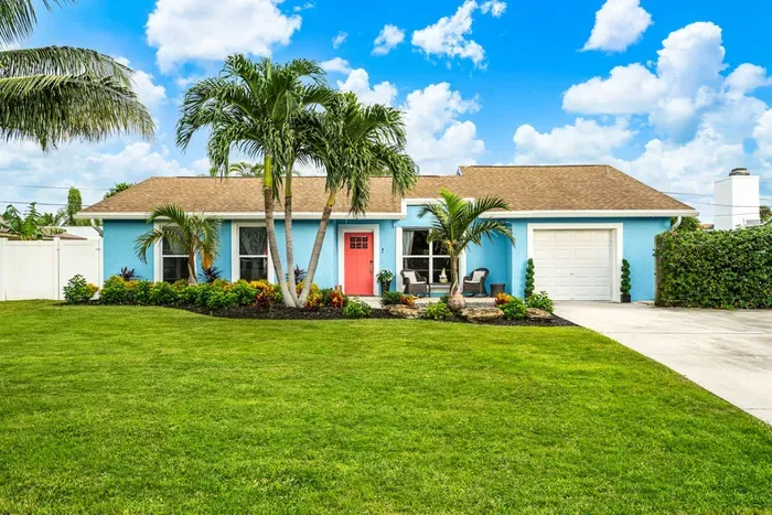 The house is nestled in the prestigious Tropic Palms neighborhood.