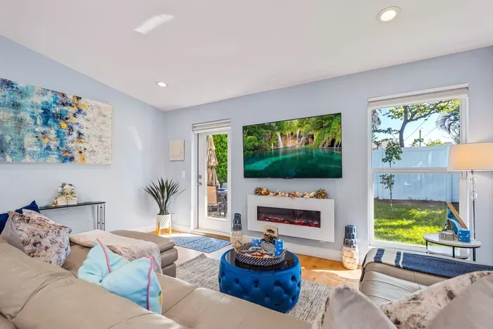 Moving on into this vaulted ceiling family room, with a 65” HDTV sat patiently waiting above the electric fireplace in front of the large comfortable sofa - put on your favorite movies and get ready for an exciting night!