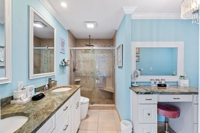 Take your time getting ready for the day while relaxing at the makeup vanity.  Your ensuite also features smart toilet bidets, which add a welcoming high tech touch to the space.