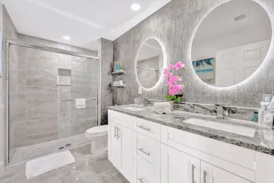 But that's not all… head to your beautiful ensuite bathroom with a his and hers sink with LED mirrors creating an aesthetic vibe. Head to your rejuvenation sanctuary - the large fully tiled walk in shower.