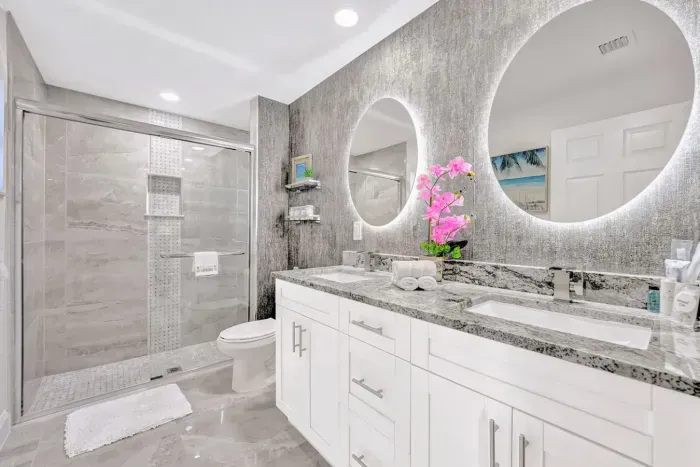 But that's not all… head to your beautiful ensuite bathroom with a his and hers sink with LED mirrors creating an aesthetic vibe. Head to your rejuvenation sanctuary - the large fully tiled walk in shower.