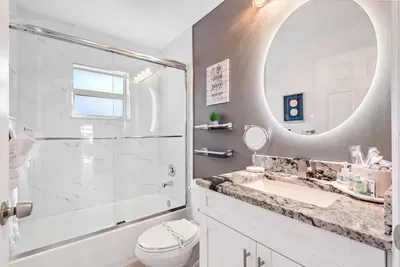Welcome into the 2nd bathroom with yet another beautiful shower area this time with a bath combo - let the water wash away your stresses of the modern day hustle and bustle and get you ready for the fun day ahead.