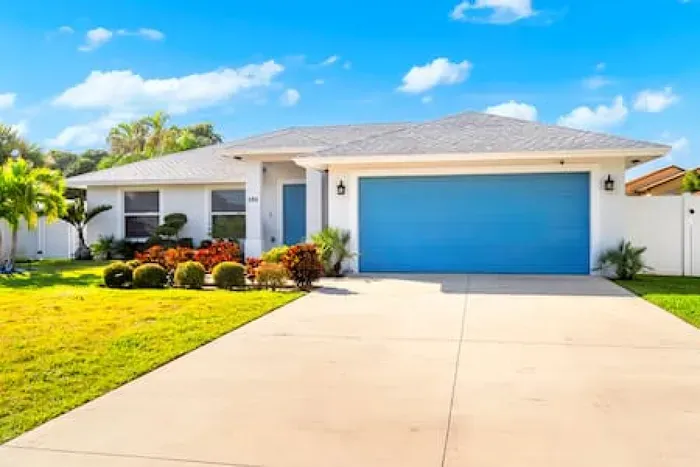 The front of your next newly constructed retreat! With a bright blue door and garage door to stand out, you can’t miss it! The moment you arrive here you will be comfortably invited by the green luscious grass with the front garden.