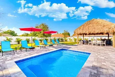 Welcome to your next stunning retreat hidden away at Delray Beach!  Starting off with the private patio pool area with sun loungers and outdoor furniture seating under the amazing Tiki Hut - creating everlasting memories in this private oasis!