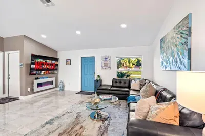 Whilst sitting on the comfy living room sofa with the nearby lamp providing the ambient lighting, put on your favorite movies with the huge 75” Roku HDTV. The perfect place to be for your evening entertainment whilst the fireplace adds a cozy vibe.