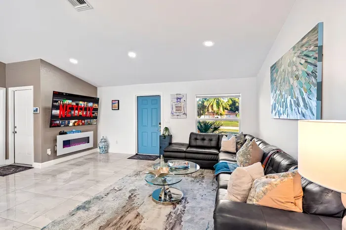 Whilst sitting on the comfy living room sofa with the nearby lamp providing the ambient lighting, put on your favorite movies with the huge 75” Roku HDTV. The perfect place to be for your evening entertainment whilst the fireplace adds a cozy vibe.