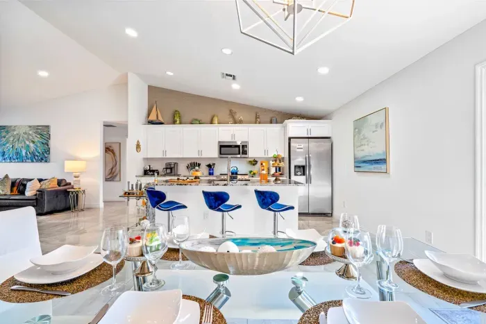 Once your kitchen creations are done, head to the glorious glass dining table with a unique light above. Take a seat on one of the 6 chairs and enjoy your evening meal together with your loved ones.