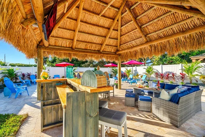 Host the ultimate BBQ party on the spacious patio with a bar, outdoor dining table and seating.