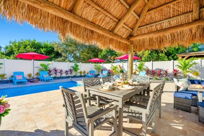 Escape to your paradise under the charming tiki hut, perfect for shade and relaxation.