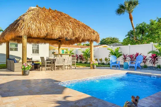 Are you ready for an unforgettable vacation in this stunning 3-bedroom house with a spacious swimming pool and a tiki hut?