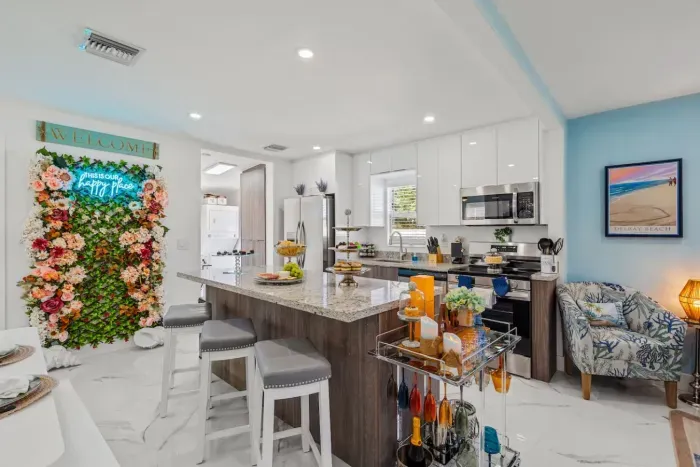 Gather around the spacious granite kitchen bar for casual meals or cocktail hour
