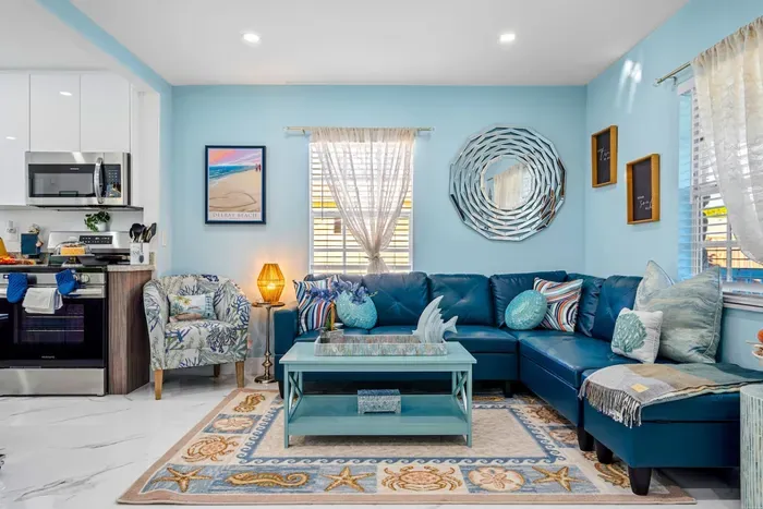 Bask in natural light flooding through large windows while relaxing in the comfy sofa chair.