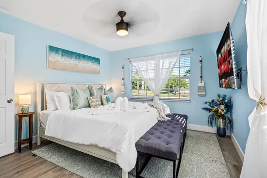 Retreat to the master suite featuring a plush king-size bed and private ensuite bathroom