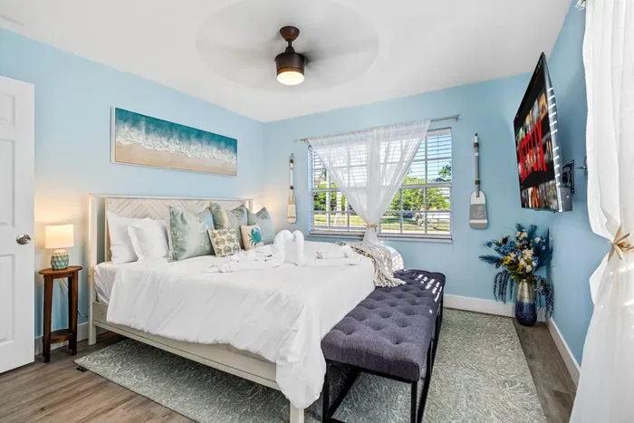 Retreat to the master suite featuring a plush king-size bed and private ensuite bathroom