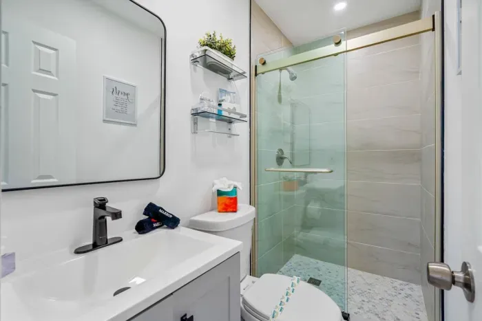 Start your day right with well-lit vanities and large mirrors in both bathrooms.