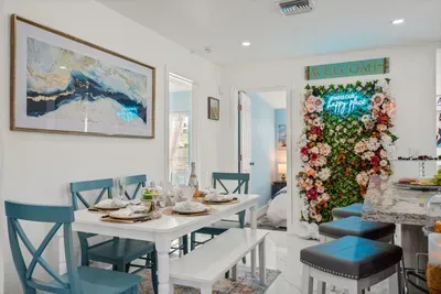 The green wall with a neon sign offers an ideal setting for an #Instaworthy photo session.