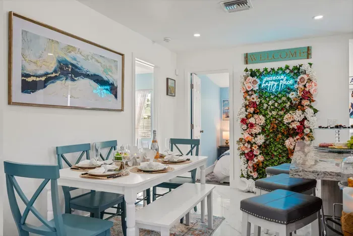 The green wall with a neon sign offers an ideal setting for an #Instaworthy photo session.