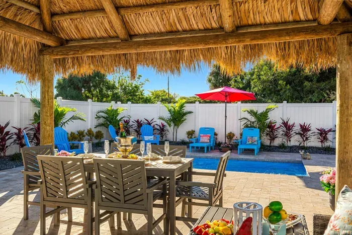 Admire the gorgeous landscaping that creates a lush, tropical atmosphere throughout the property.