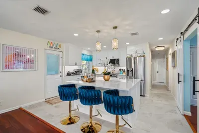 The fully equipped kitchen with quartz countertops is ready for your MasterChef skills.