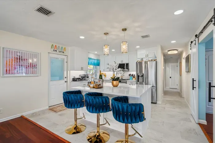 The fully equipped kitchen with quartz countertops is ready for your MasterChef skills.