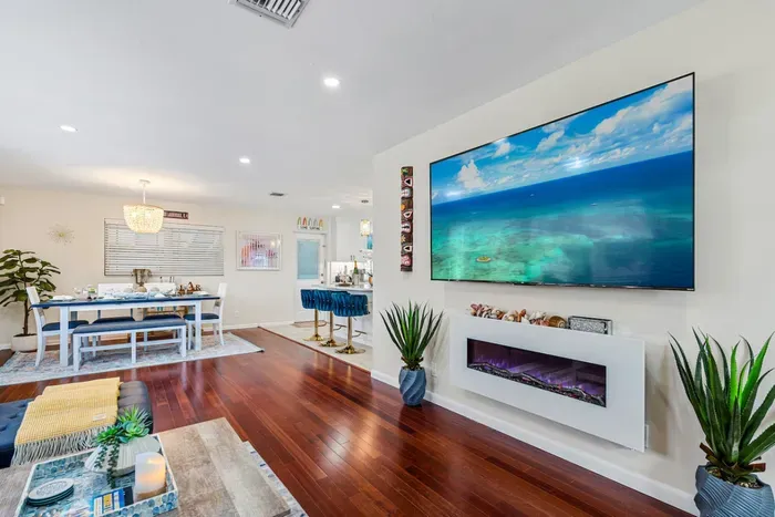 The modern smart TV is set up so you can see it from every angle of the spacious open-plan living area.