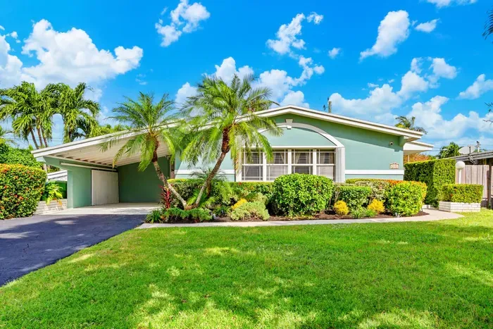 Tropical ambiance will greet you when you park on the driveway.