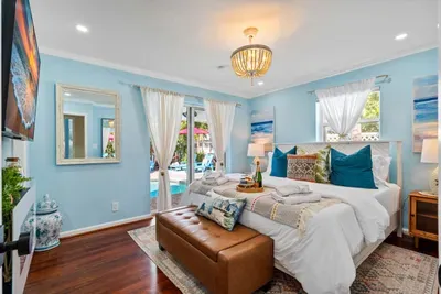 Sleep like a royal family member on the king-size bed found in the master bedroom.