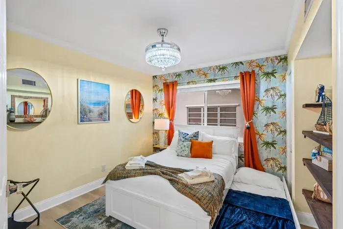 Queen bedroom with a twin trundle bed, offering flexible sleeping space that’s perfect for families, kids, and group vacations in Fort Lauderdale.
