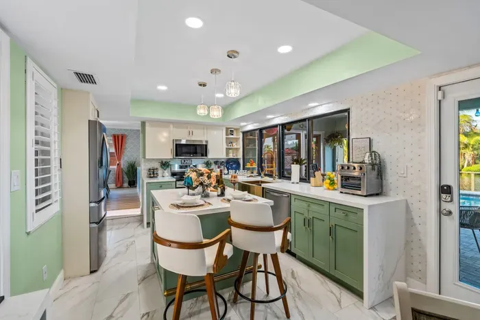 Choose from multiple dining areas, all nestled by the fully equipped kitchen.