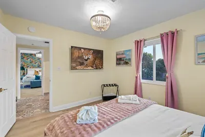 Unwind after the pool in a comfortable space with a large Smart TV and cozy bedding for restful nights.