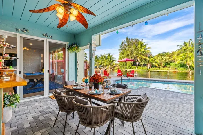 Share meals together at the outdoor dining table under cover, perfect for family breakfasts, group dinners, and relaxed evenings by the water.