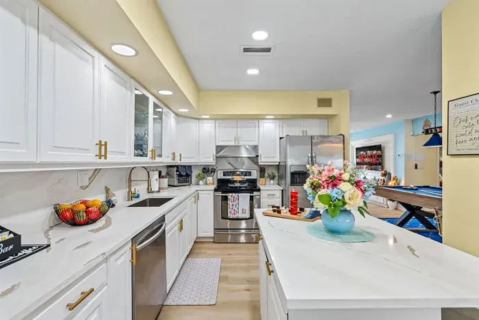 Bright kitchen with plenty of prep space—perfect for breakfast before the beach or dinner at home.