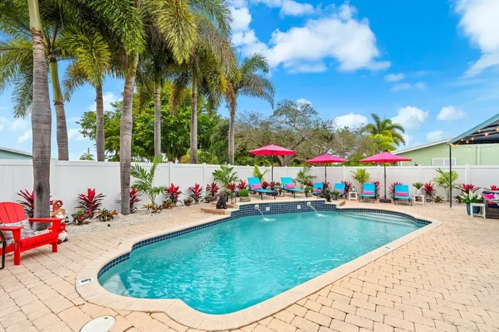 Private heated pool in Lighthouse Point! Enjoy comfortable swims year-round in your own sunny backyard oasis.