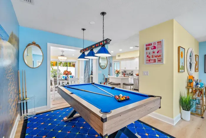 Cozy indoor hangout featuring a pool table—great for downtime after beach days and excursions.