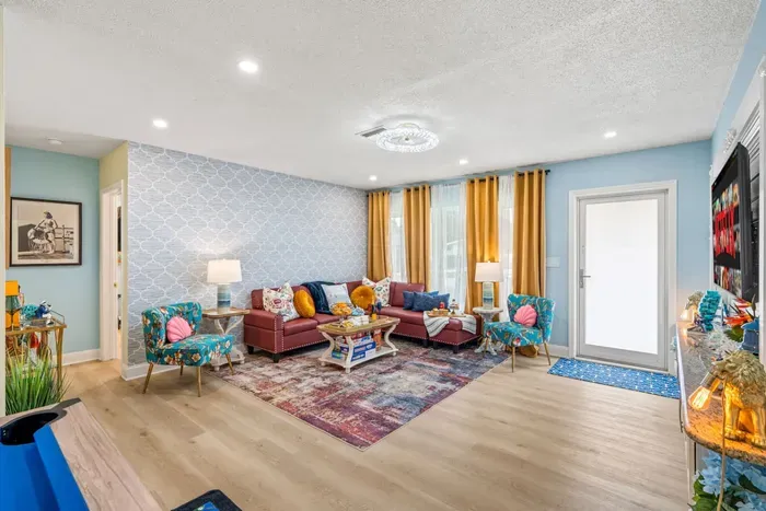 Coastal South Florida vibe in a welcoming living room—your home base near beaches and attractions.