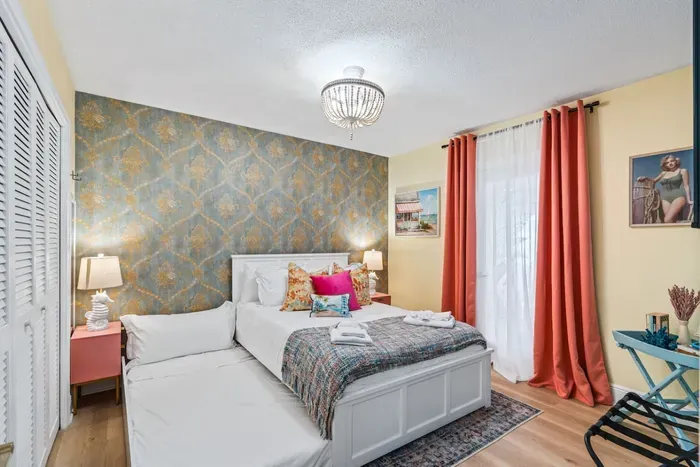 Spacious sleeping setup with a queen bed and a trundle, providing room for everyone to spread out.