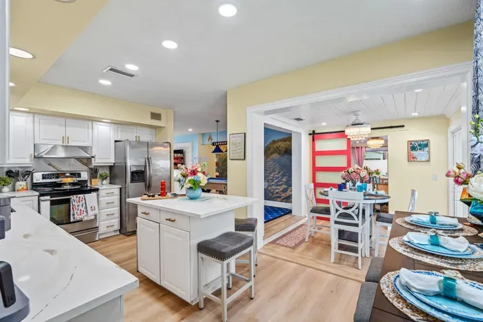 Cook, chat, and connect—kitchen flows seamlessly into living and dining for effortless together time.