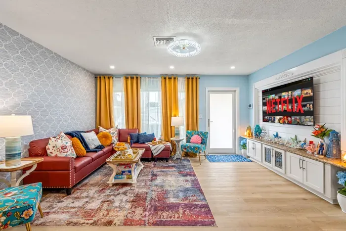 Relax in a cozy living room retreat in Lighthouse Point—ideal for multi-generation travel and kids.