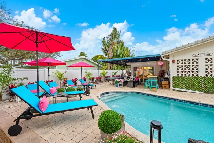 Resort-style heated pool with a soothing water feature, designed for families, groups, and all-day lounging.