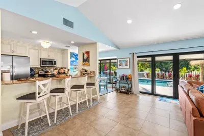 Large backyard doors allow you to gaze at the private backyard while relaxing in the cool and comfy living room.