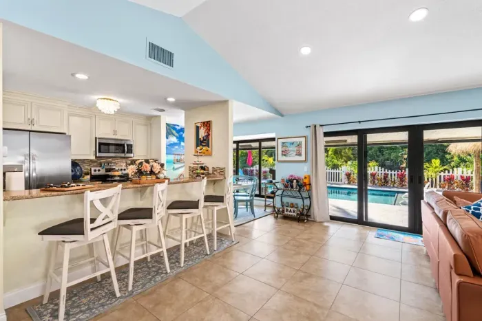 Large backyard doors allow you to gaze at the private backyard while relaxing in the cool and comfy living room.